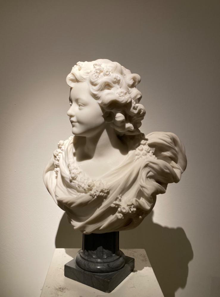 A beautiful sculpture of a young lady in 