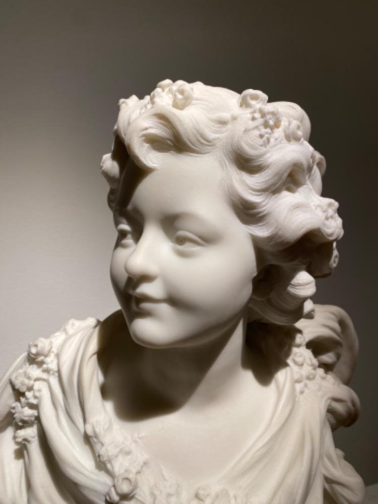 A beautiful sculpture of a young lady in 