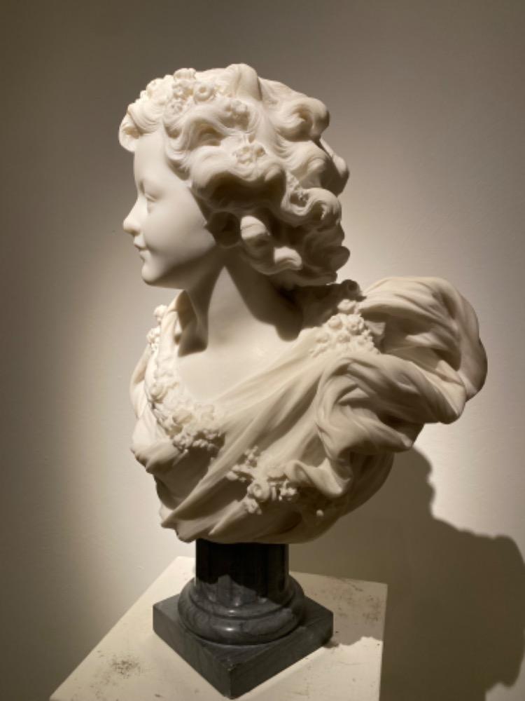 A beautiful sculpture of a young lady in 