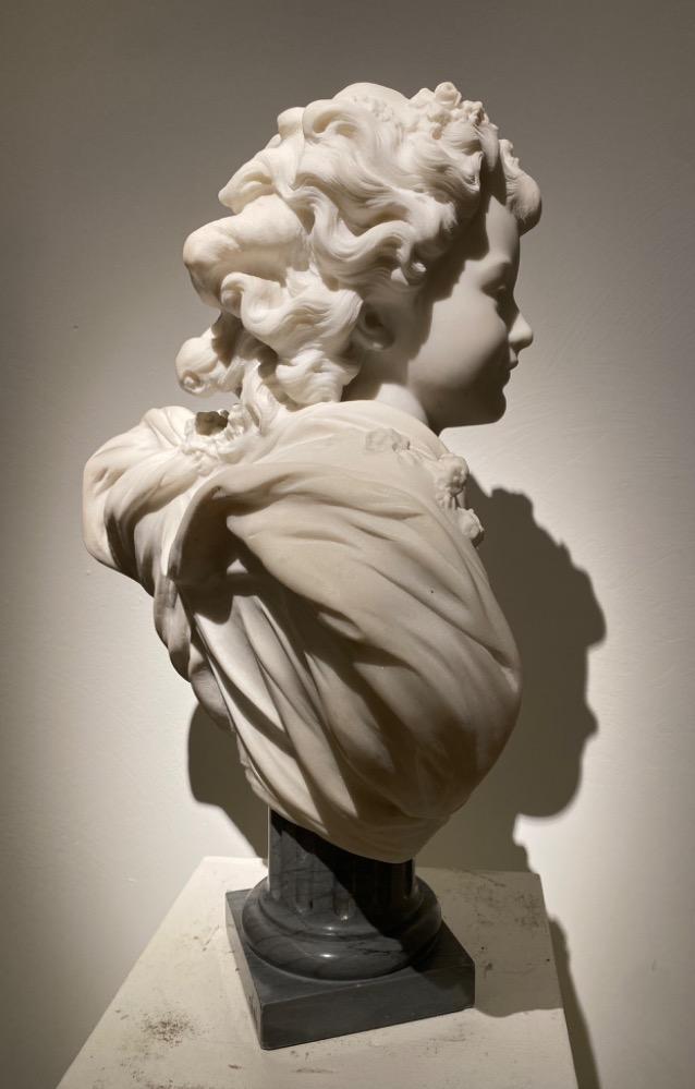 A beautiful sculpture of a young lady in 