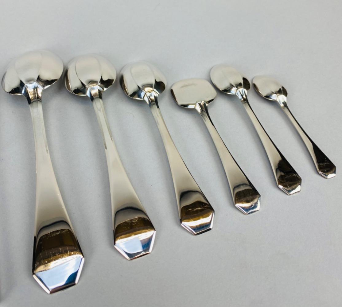 A superb Art Deco Cutlery Set For 12, Solid Silver, 222 Pieces, Complete In Its cabinet. By Delheid Frères Brussels, Model 