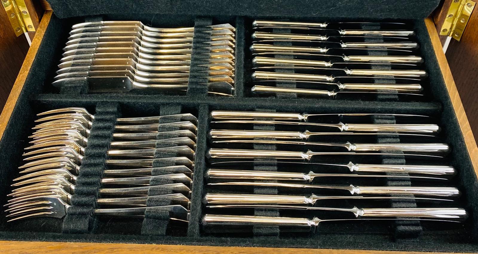 A superb Art Deco Cutlery Set For 12, Solid Silver, 222 Pieces, Complete In Its cabinet. By Delheid Frères Brussels, Model 