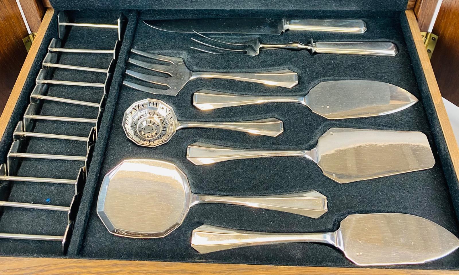 A superb Art Deco Cutlery Set For 12, Solid Silver, 222 Pieces, Complete In Its cabinet. By Delheid Frères Brussels, Model 