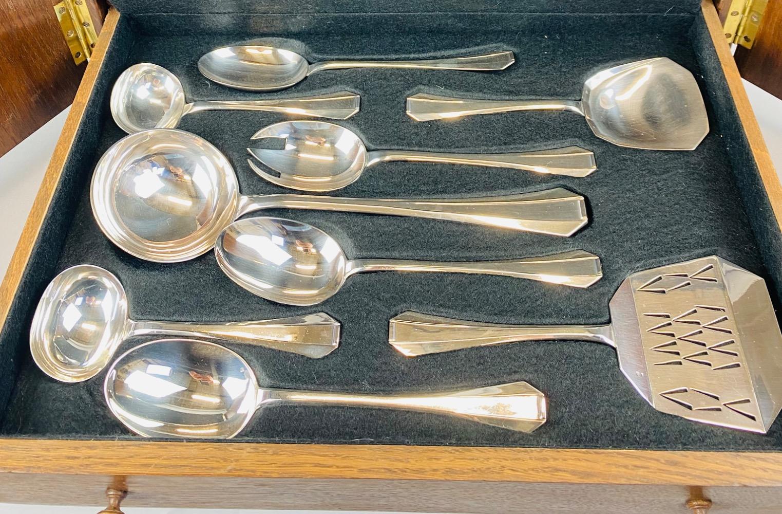 A superb Art Deco Cutlery Set For 12, Solid Silver, 222 Pieces, Complete In Its cabinet. By Delheid Frères Brussels, Model 