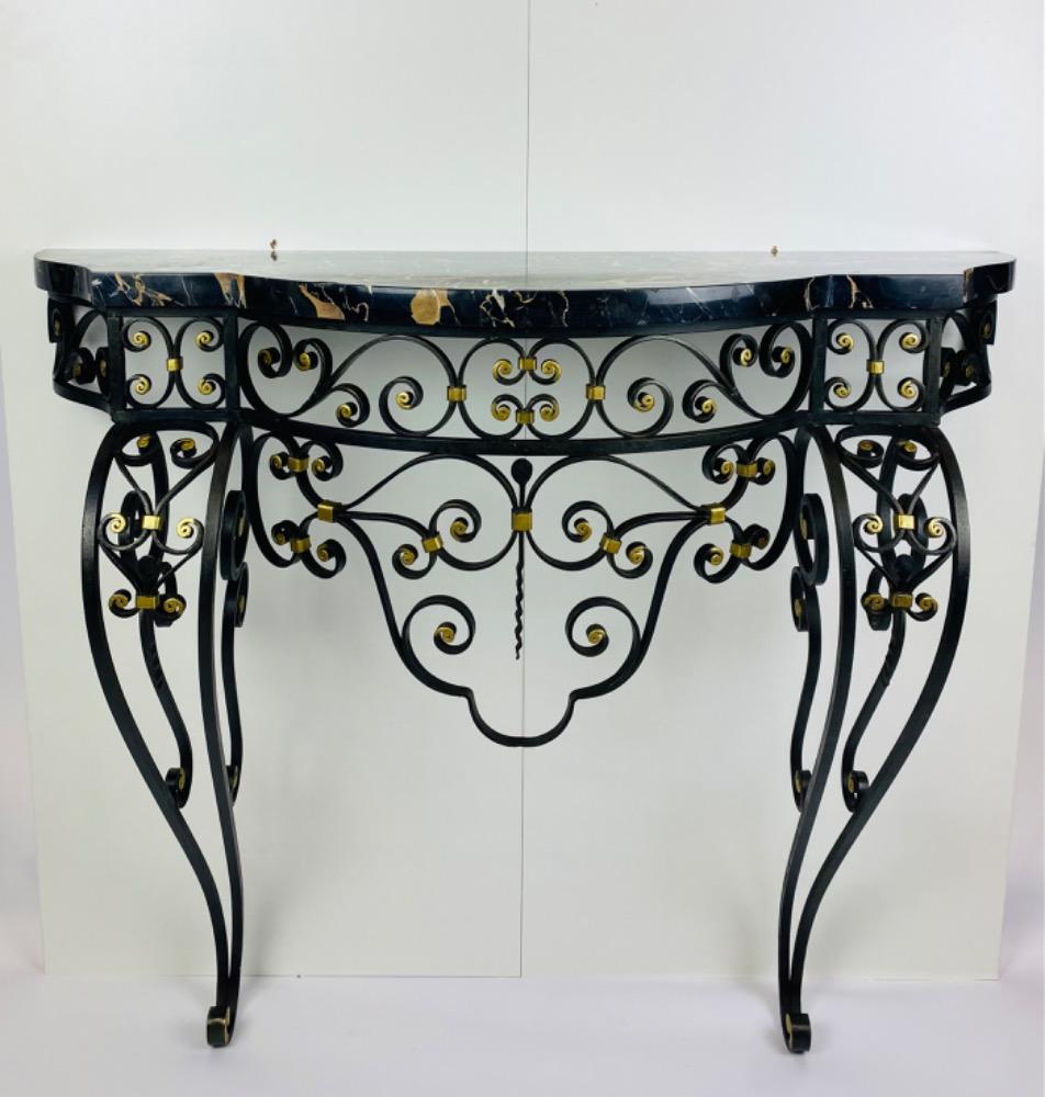 An Art Deco iron console