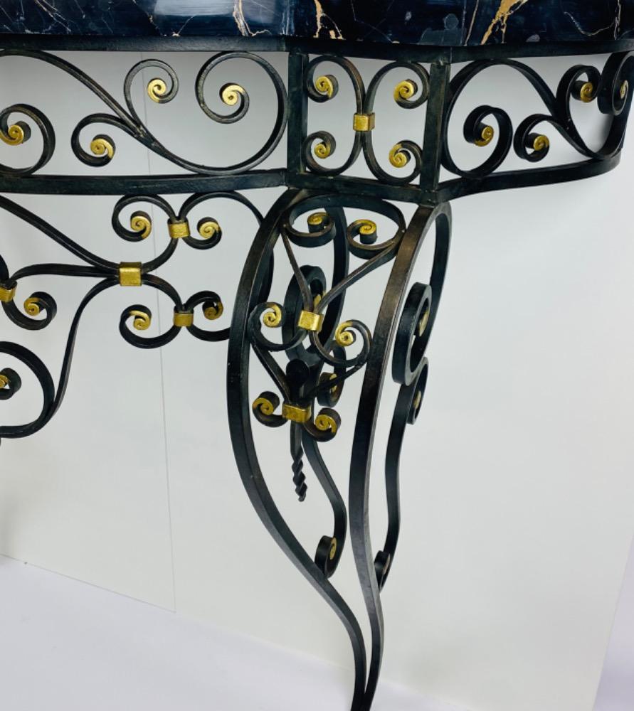 An Art Deco iron console