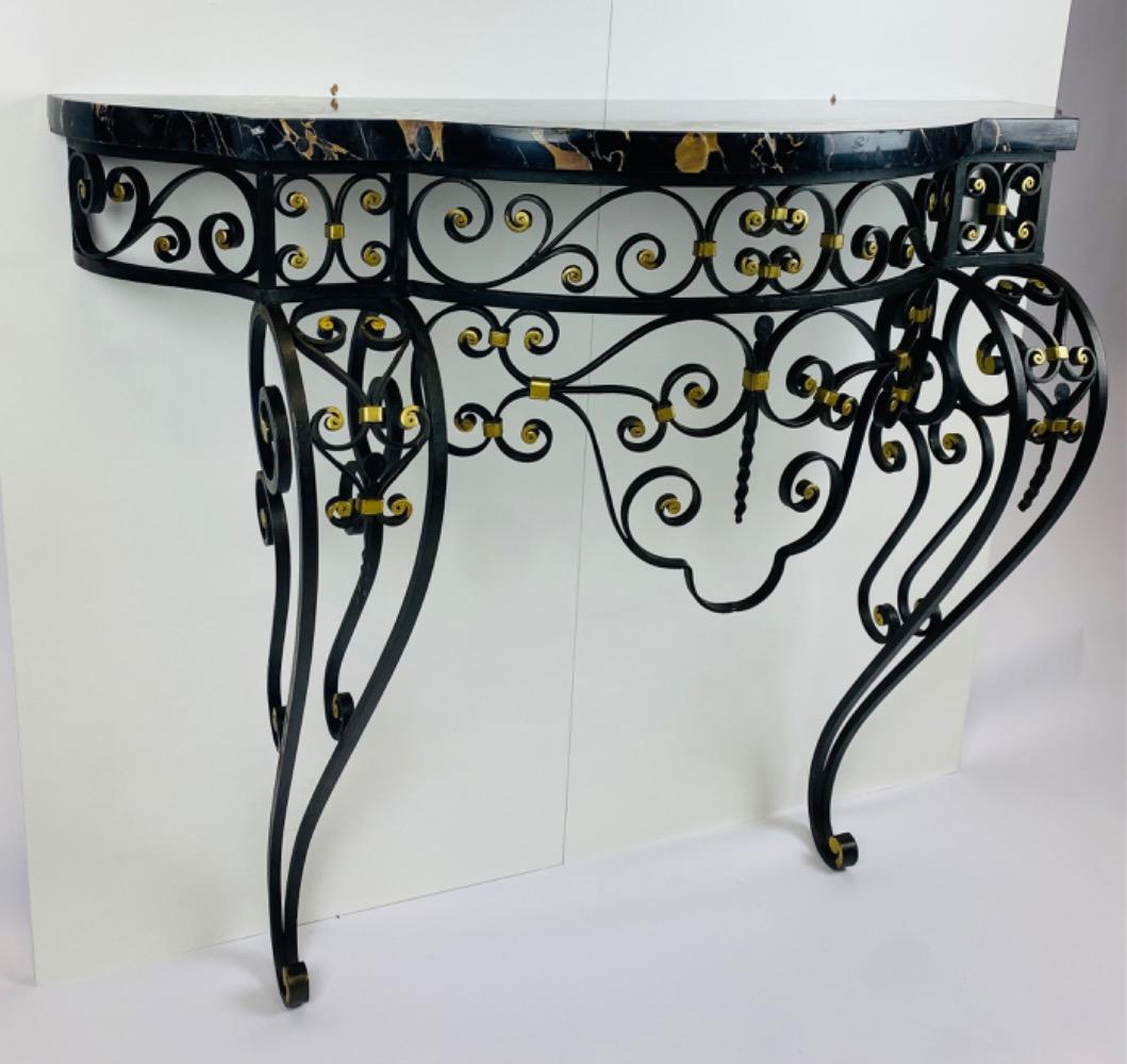 An Art Deco iron console