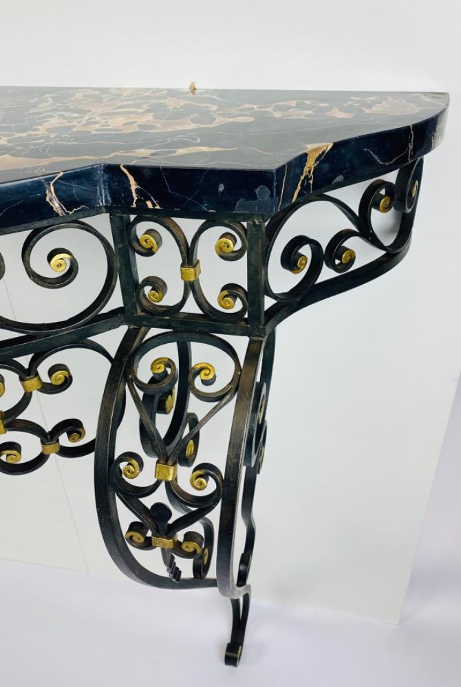 An Art Deco iron console