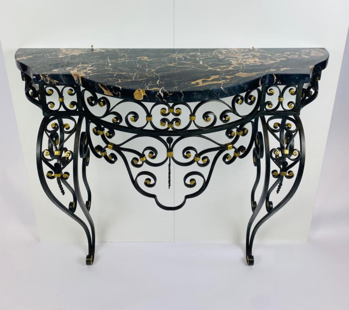 An Art Deco iron console