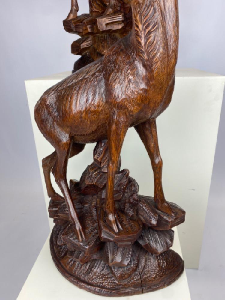 Pair large late 19thC Black Forest carved wood chamois with glass eyes.