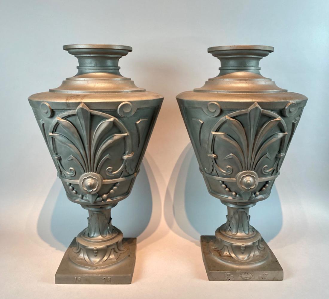 Pair of cast-iron vases. Dated 1925. 