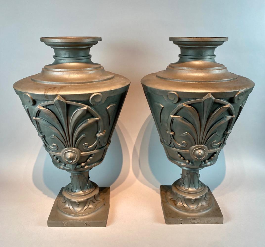 Pair of cast-iron vases. Dated 1925. 