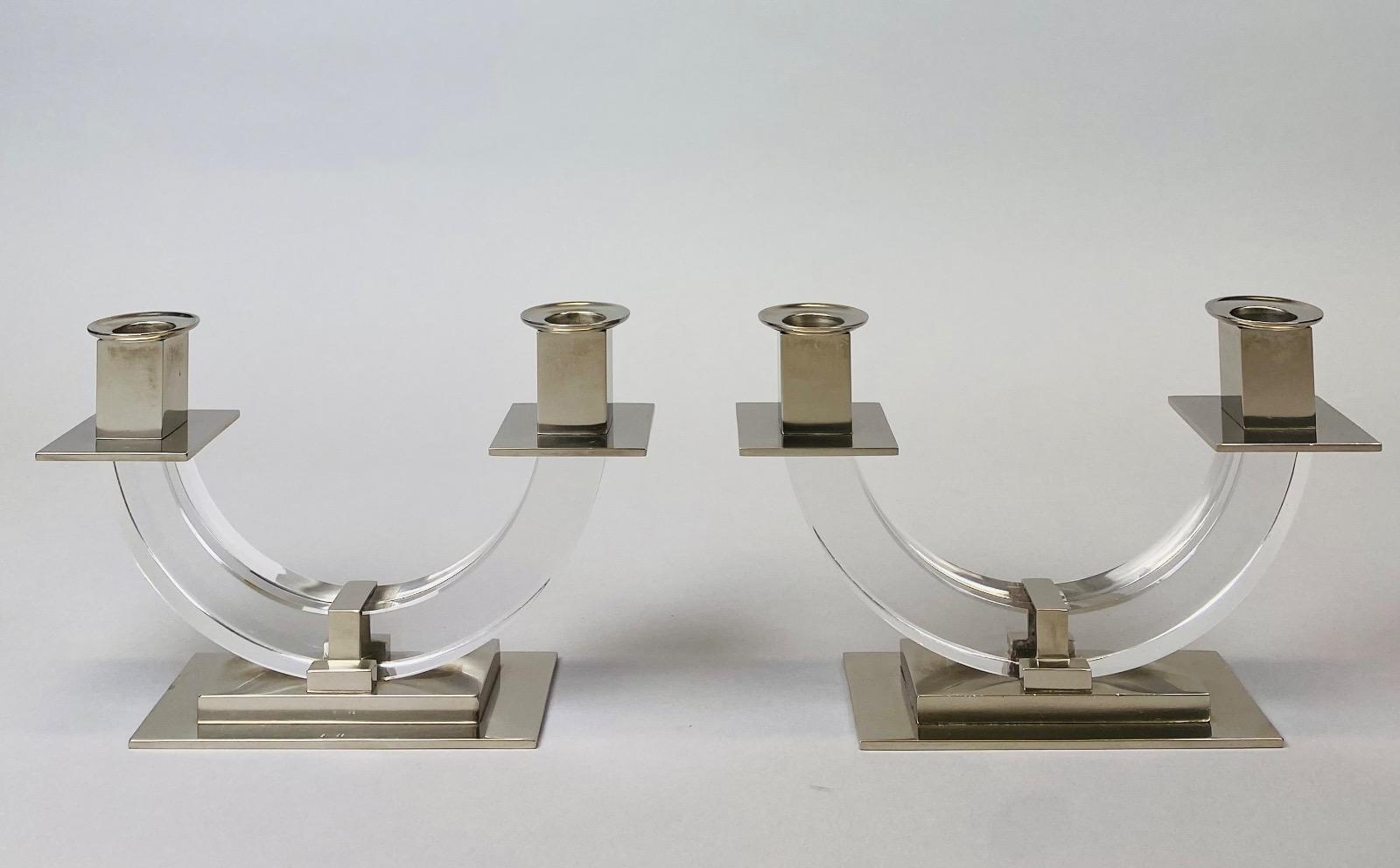 Pair of modernist candelabras attr. to Jacques Adnet.