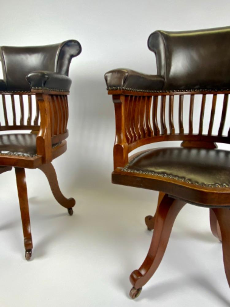 Pair Victorian mahogany & leather revolving desk chairs.