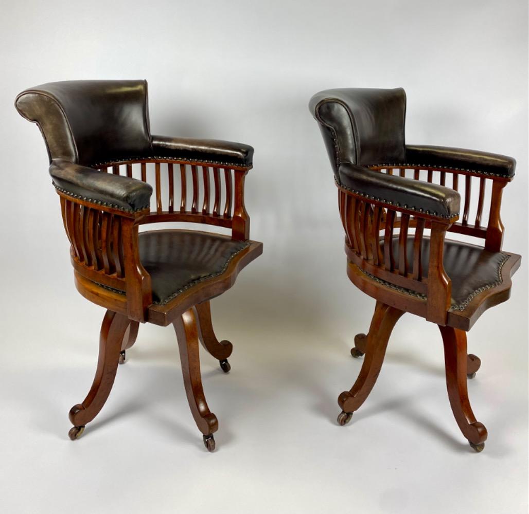 Pair Victorian mahogany & leather revolving desk chairs.